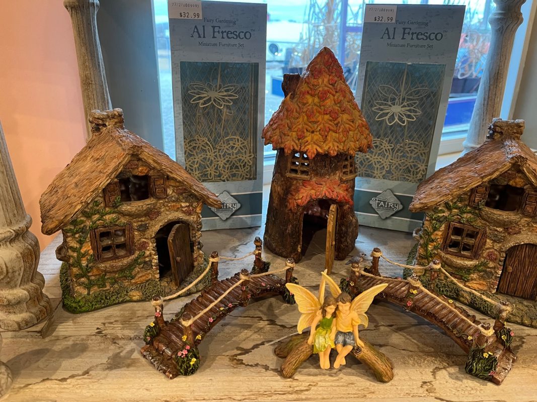 Indoor display of Fairy Garden brand houses, fairies and accessories.
