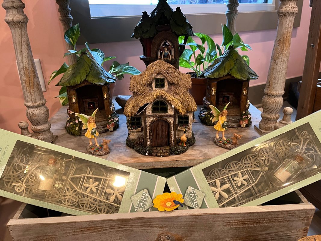 Display of Fairy Garden brand houses, fairies, and accessories at Full Features Garden Center.