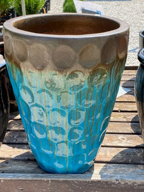 Aqua and brown textured flower pot, ceramic, large, on wooden shelf display at Full Features Garden Center.